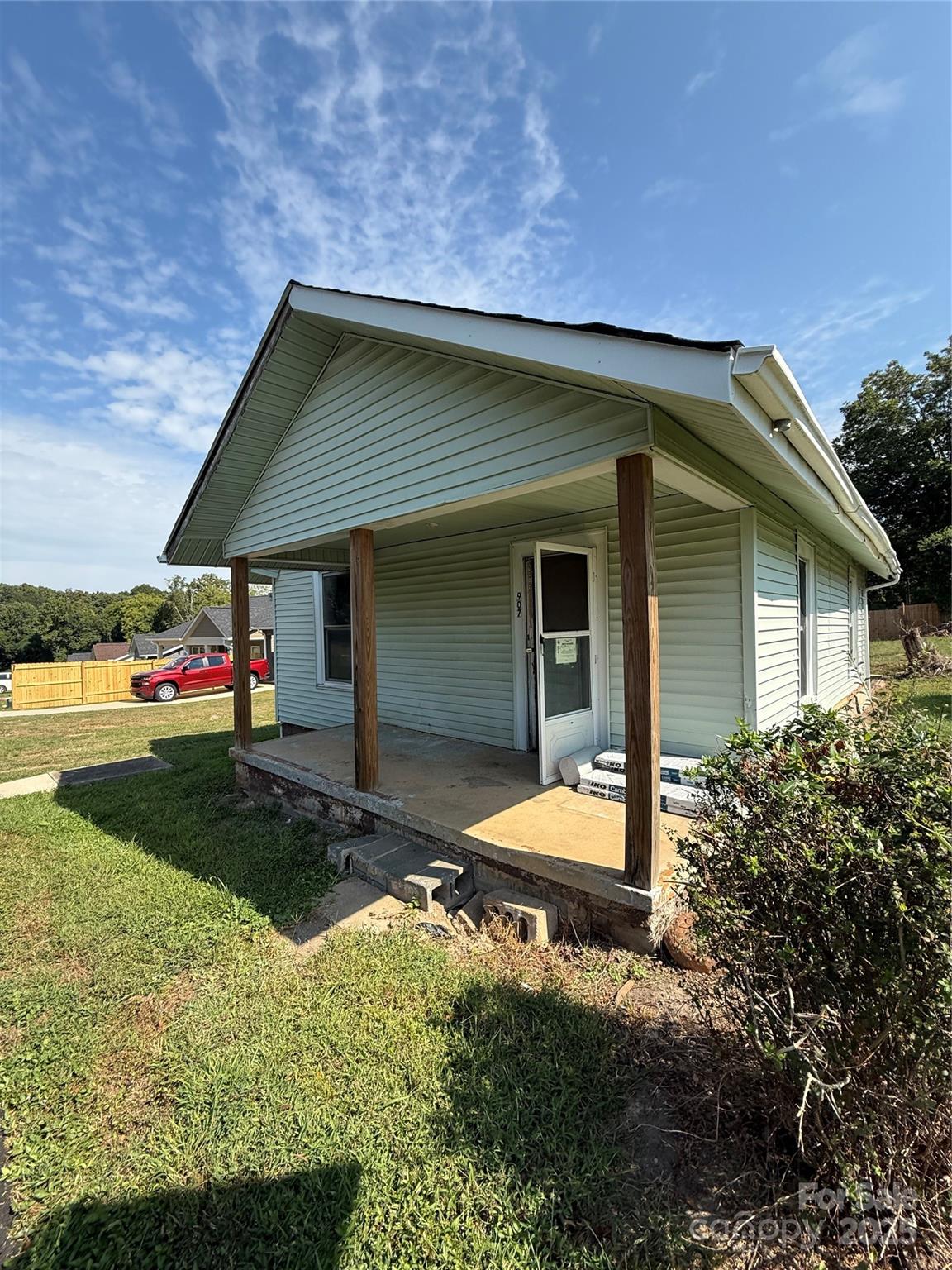 907 3rd St Court Southwest Hickory, NC 28602 - Photo 1 of 17 a backyard of a house with yard and outdoor seating