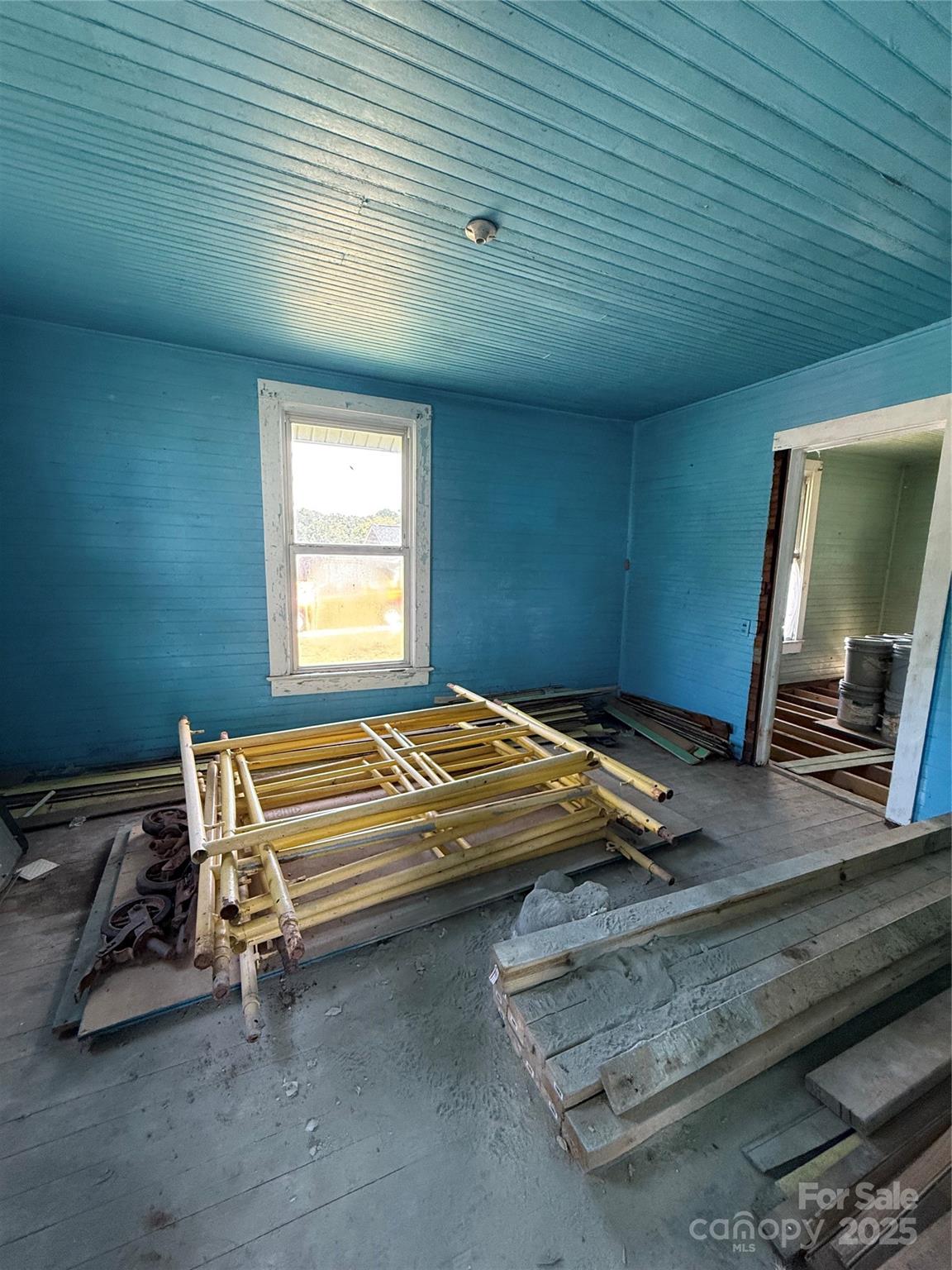 907 3rd St Court Southwest Hickory, NC 28602 - Photo 12 of 17 a bedroom with a bed and a flat tv screen on the dresser