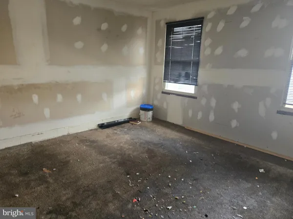 a view of empty room with windows