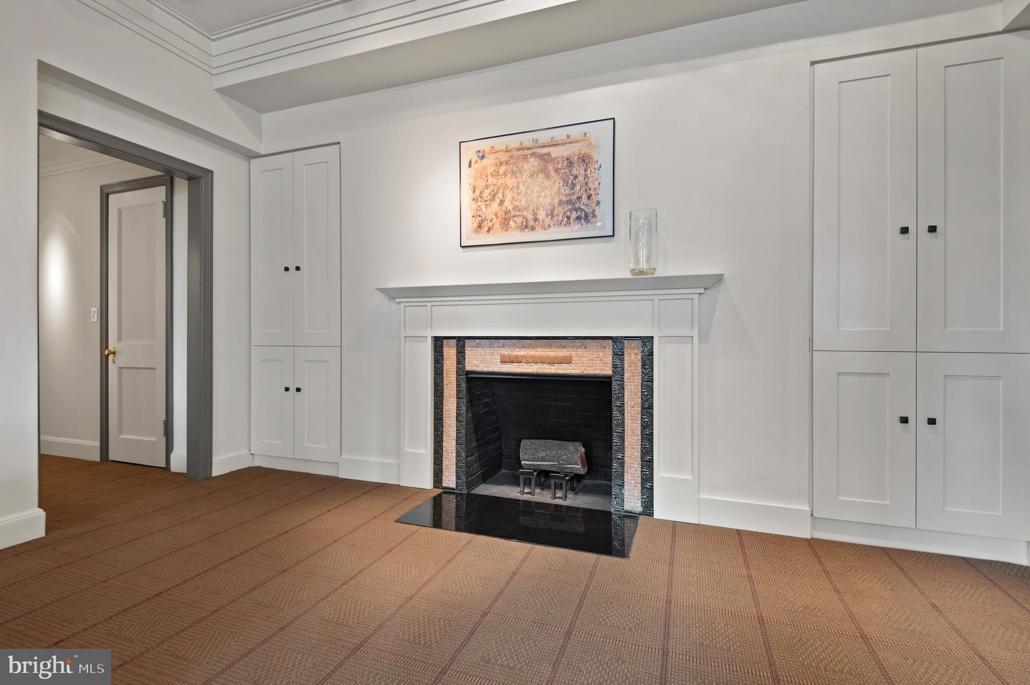 3908 North Charles Street, Unit 501 Baltimore, MD 21218 - Photo 15 of 54 a view of an empty room with window and fireplace