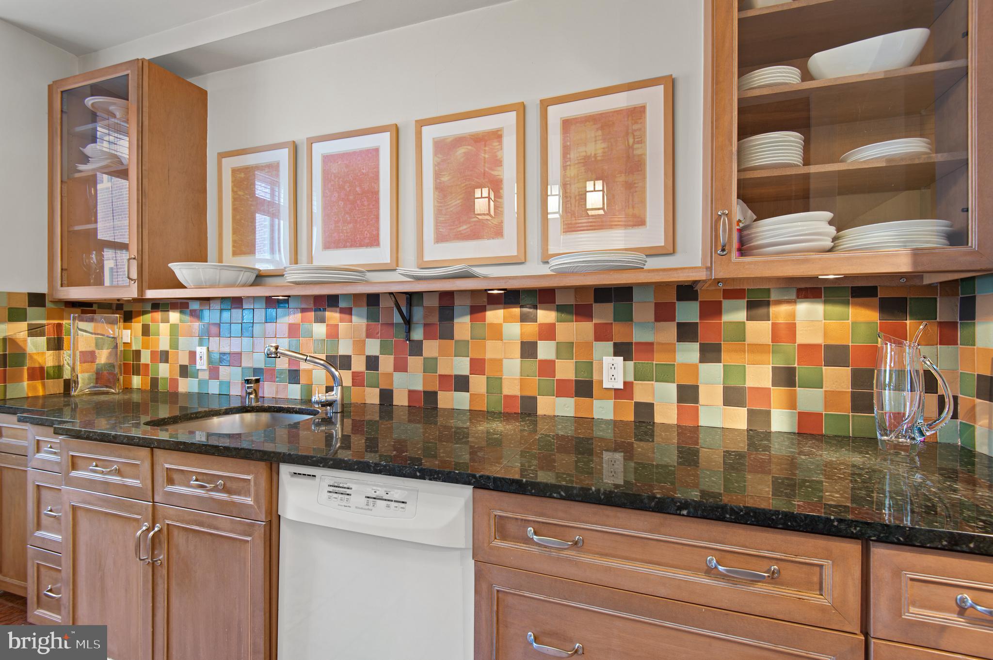 3908 North Charles Street, Unit 501 Baltimore, MD 21218 - Photo 21 of 54 a kitchen with granite countertop a sink and cabinets