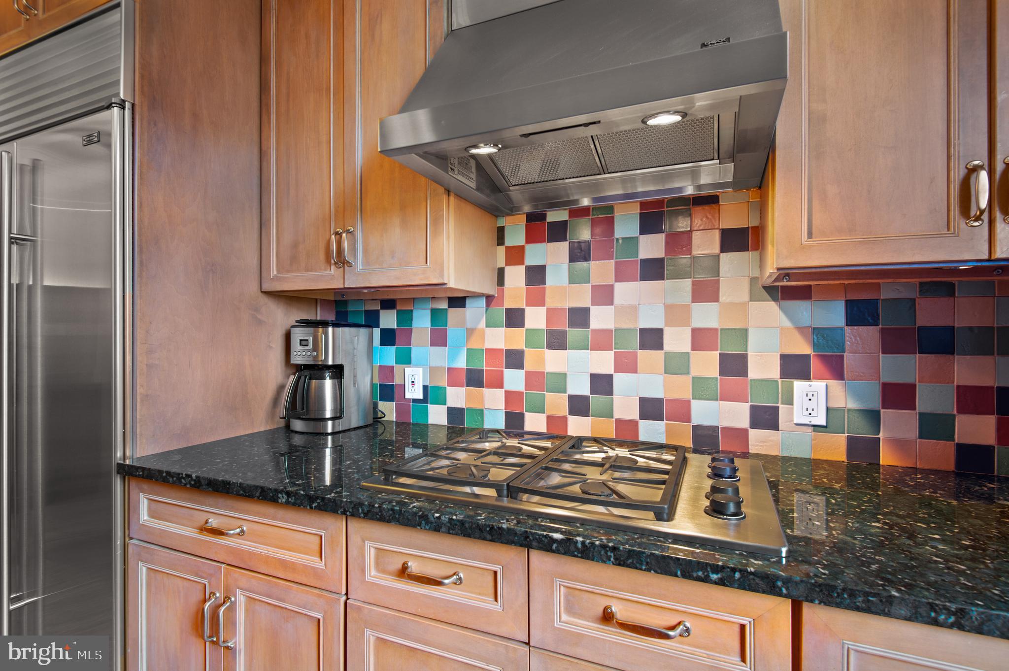 3908 North Charles Street, Unit 501 Baltimore, MD 21218 - Photo 22 of 54 a kitchen with granite countertop a sink and cabinets