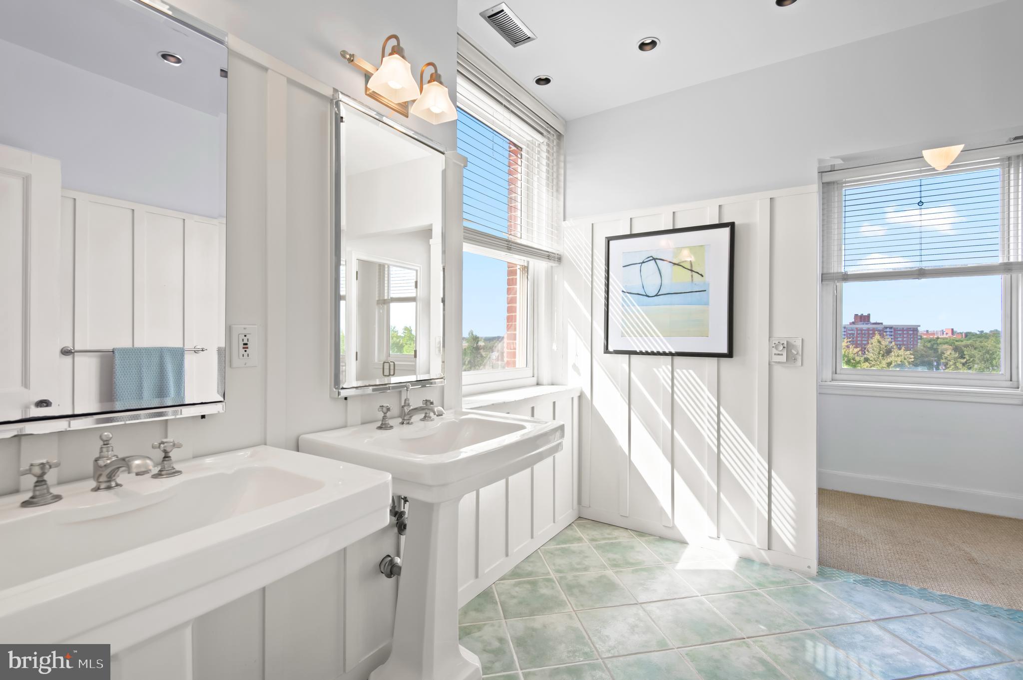 3908 North Charles Street, Unit 501 Baltimore, MD 21218 - Photo 30 of 54 a spacious bathroom with a double vanity sink mirror and a bathtub