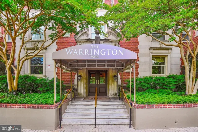 a front view of a building with garden