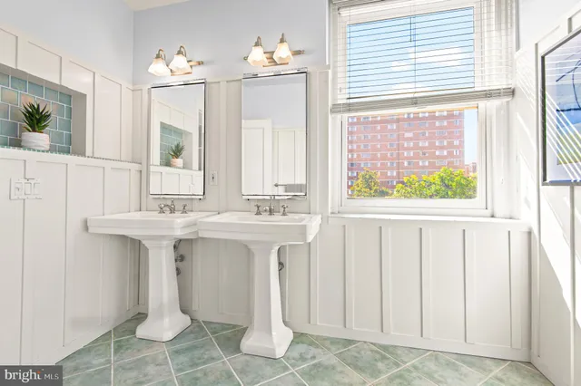 a view of an entryway with wooden floor and windows