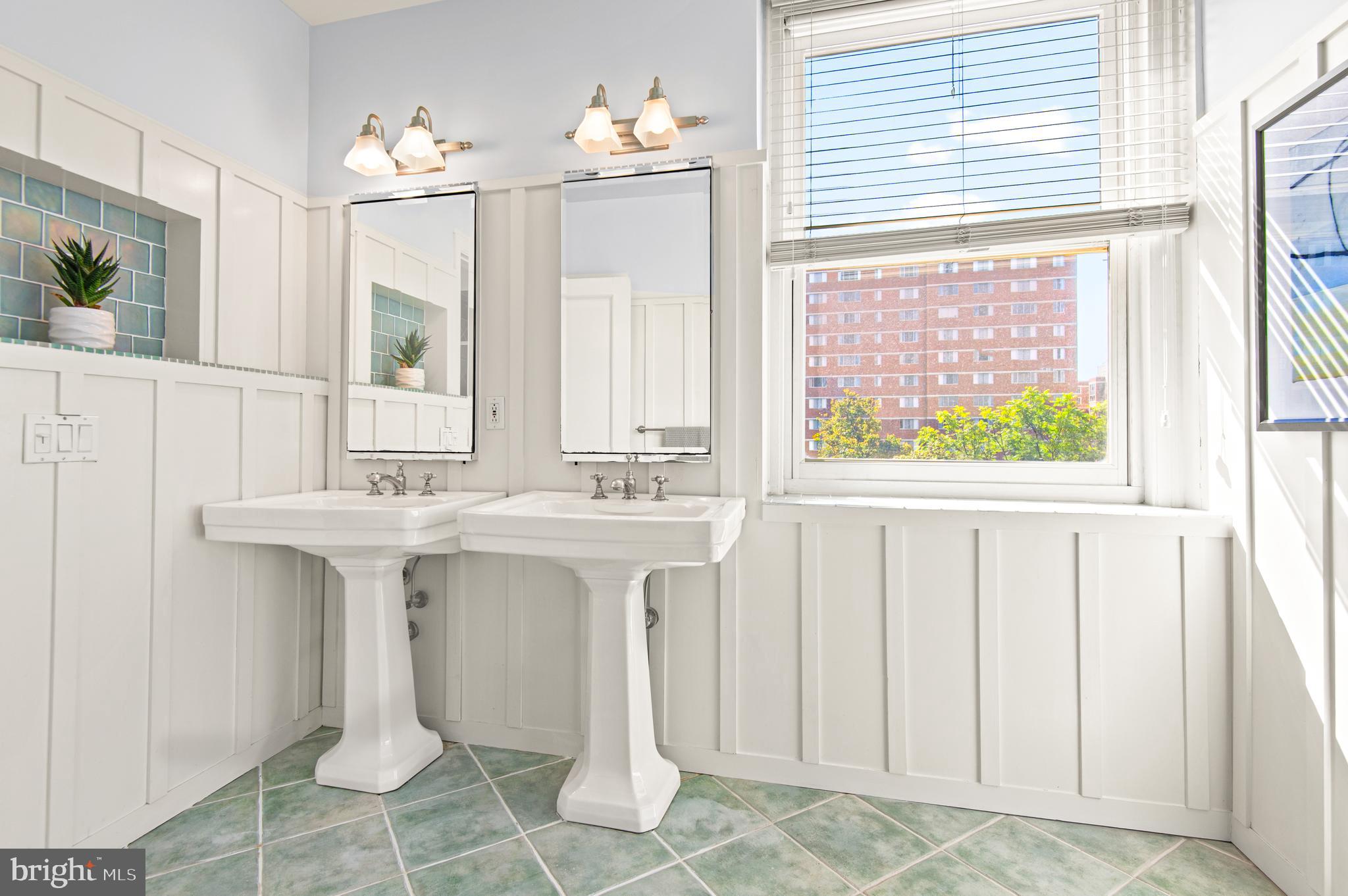 3908 North Charles Street, Unit 501 Baltimore, MD 21218 - Photo 31 of 54 a bathroom with a sink and a mirror
