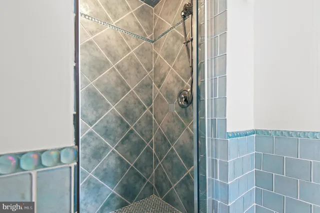 a bedroom with furniture and a book shelf