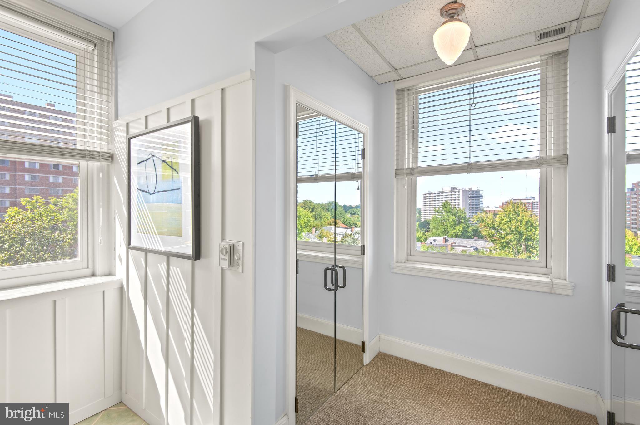 3908 North Charles Street, Unit 501 Baltimore, MD 21218 - Photo 35 of 54 a view of an entryway with wooden floor and windows
