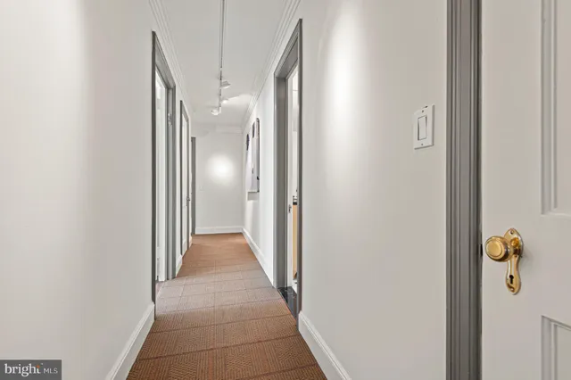 a bathroom with a granite countertop sink a toilet a mirror and shower