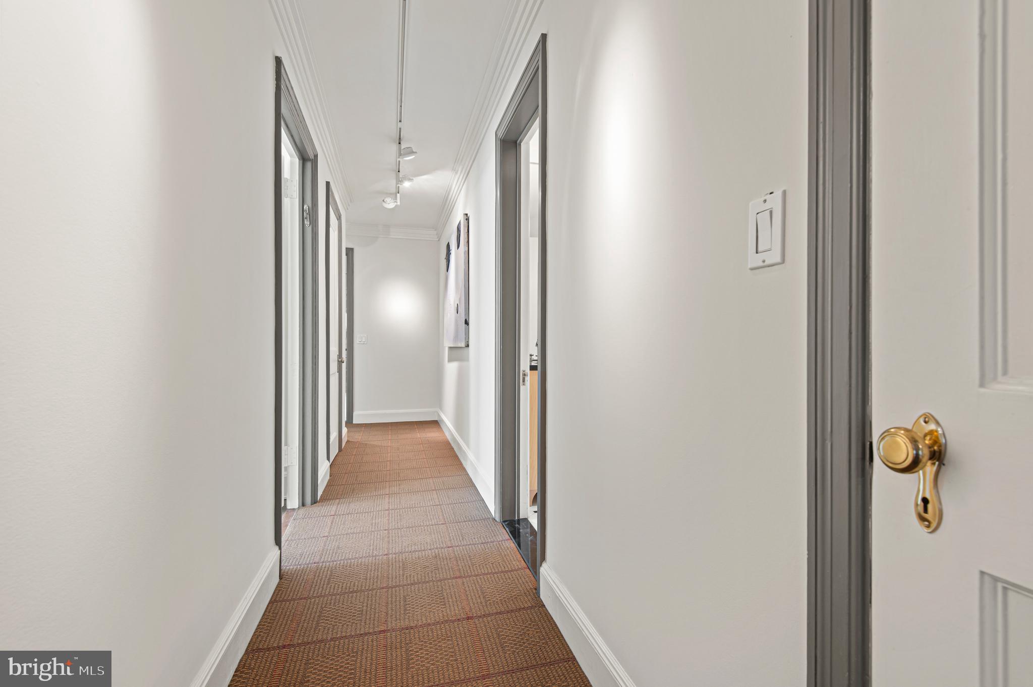 3908 North Charles Street, Unit 501 Baltimore, MD 21218 - Photo 36 of 54 a view of a hallway with wooden floor