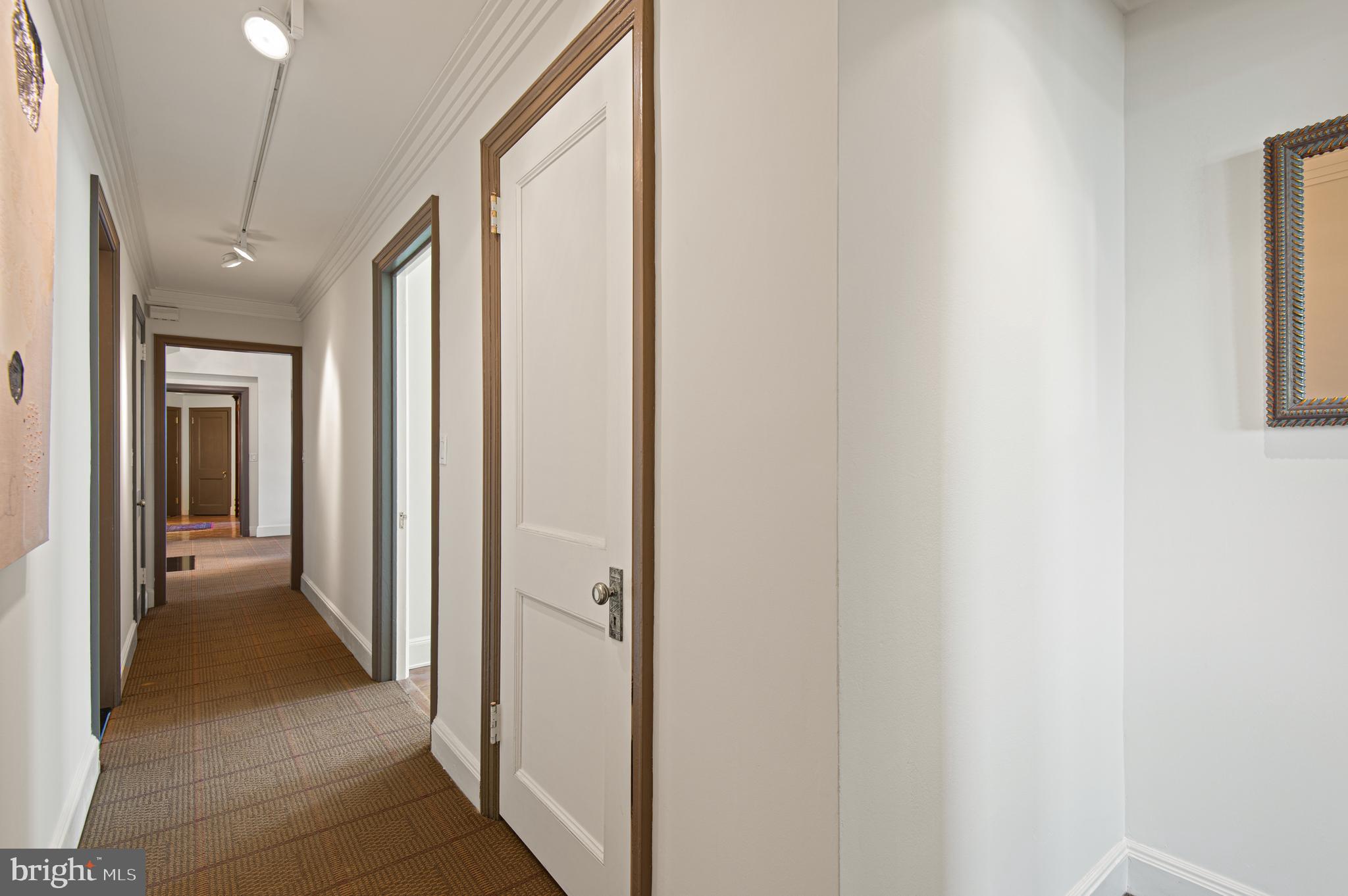 3908 North Charles Street, Unit 501 Baltimore, MD 21218 - Photo 37 of 54 a view of a hallway with closet and a couch