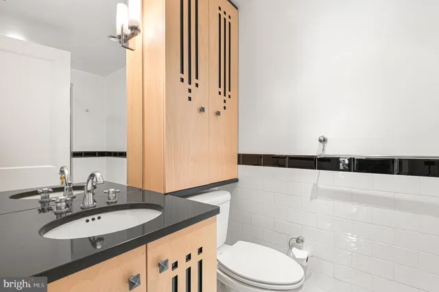 a view of a bench in the garden near a lake