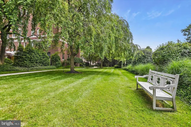a view of a table and chairs in the garden
