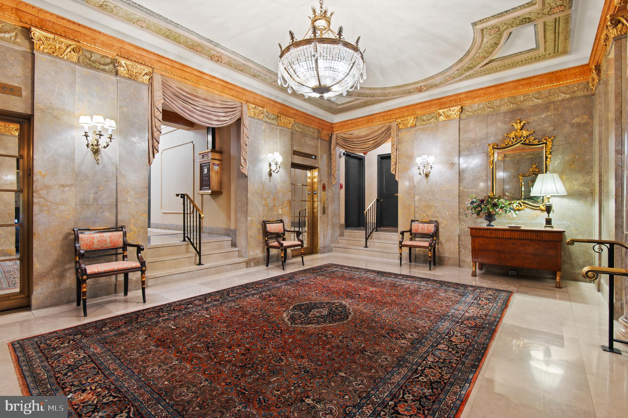 3908 North Charles Street, Unit 501 Baltimore, MD 21218 - Photo 5 of 54 a living room with furniture a dining table and a chandelier