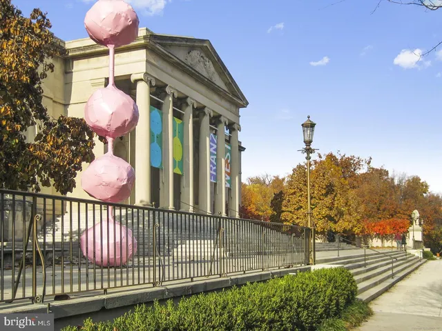 a view of a chairs with a table and chairs under an umbrella
