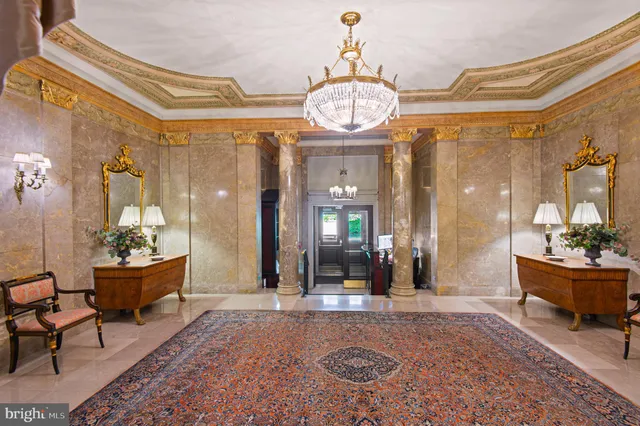 a view of a very nice looking dining room with a table and chairs