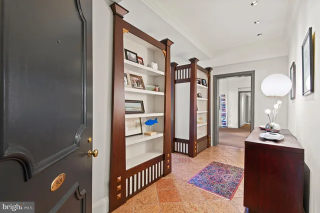 a view of a livingroom with an entryway and livingroom