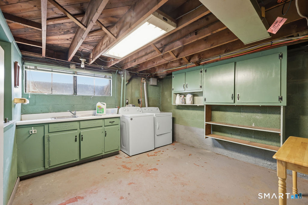 630 South Elm Street Wallingford, CT 06492 - Photo 24 of 30 a utility room with faucet dryer and washer