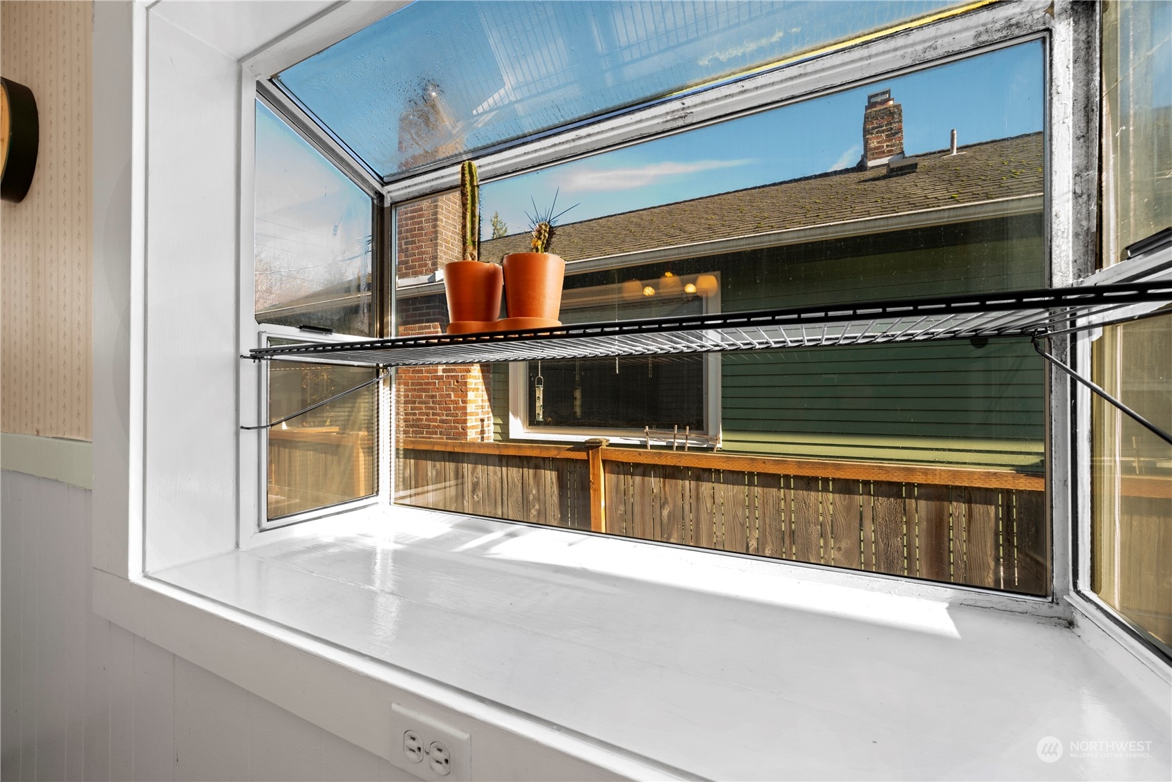 517 North 84th Street Seattle, WA 98103 - Photo 12 of 29 a living room with a window and flowerpot