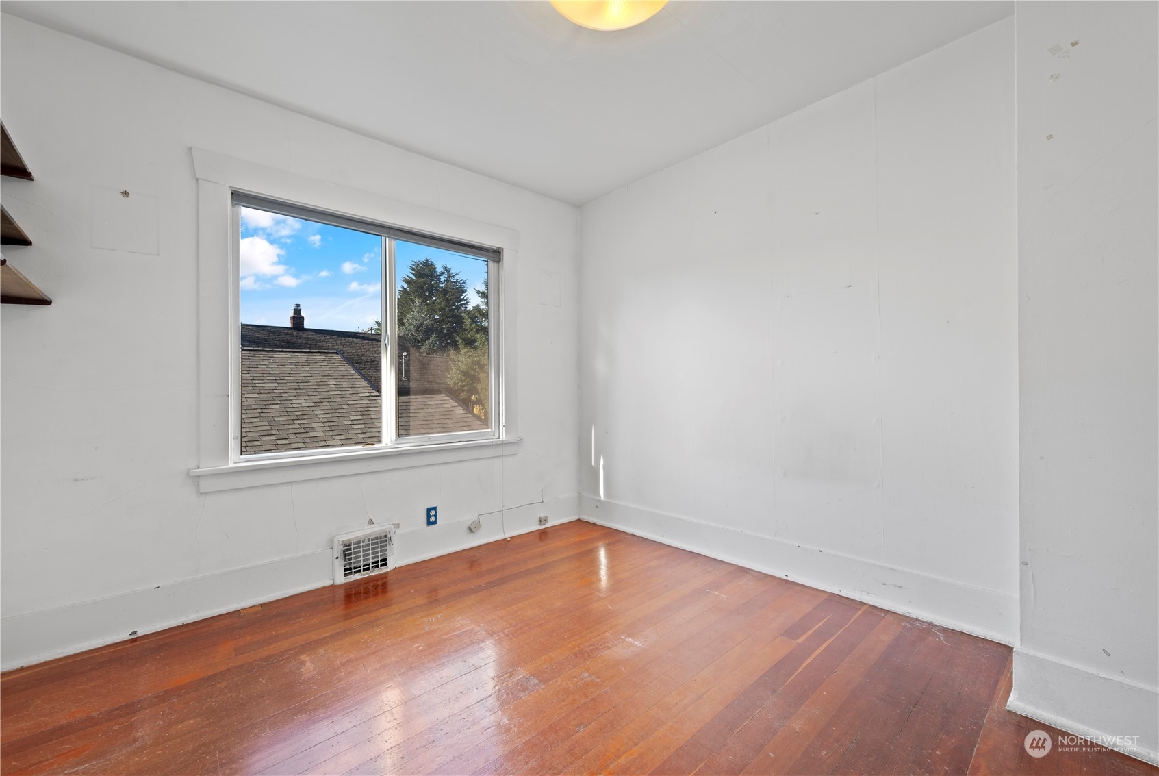 517 North 84th Street Seattle, WA 98103 - Photo 13 of 29 an empty room with a window