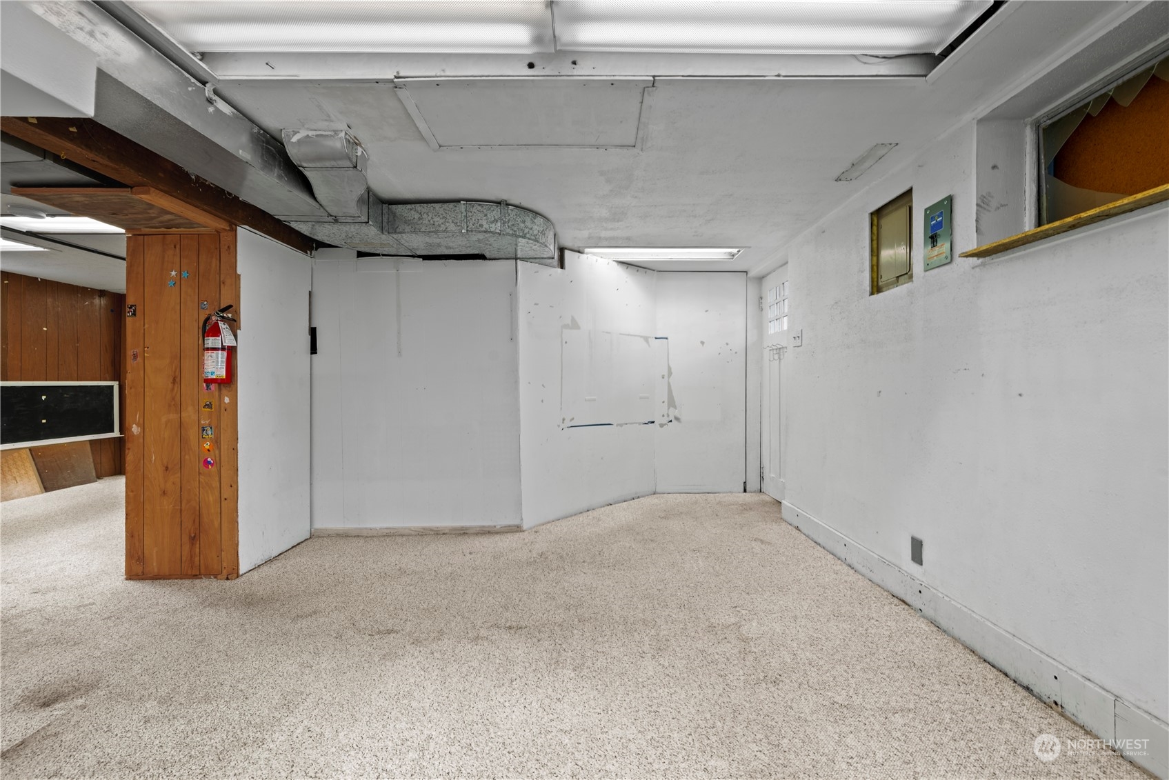 517 North 84th Street Seattle, WA 98103 - Photo 17 of 29 a view of a hallway with wooden walls