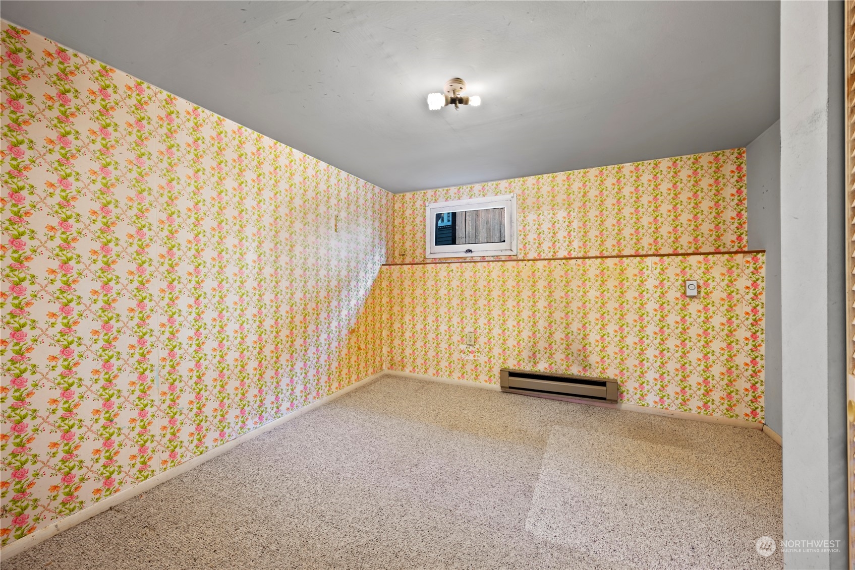 517 North 84th Street Seattle, WA 98103 - Photo 19 of 29 a view of an empty room and a window