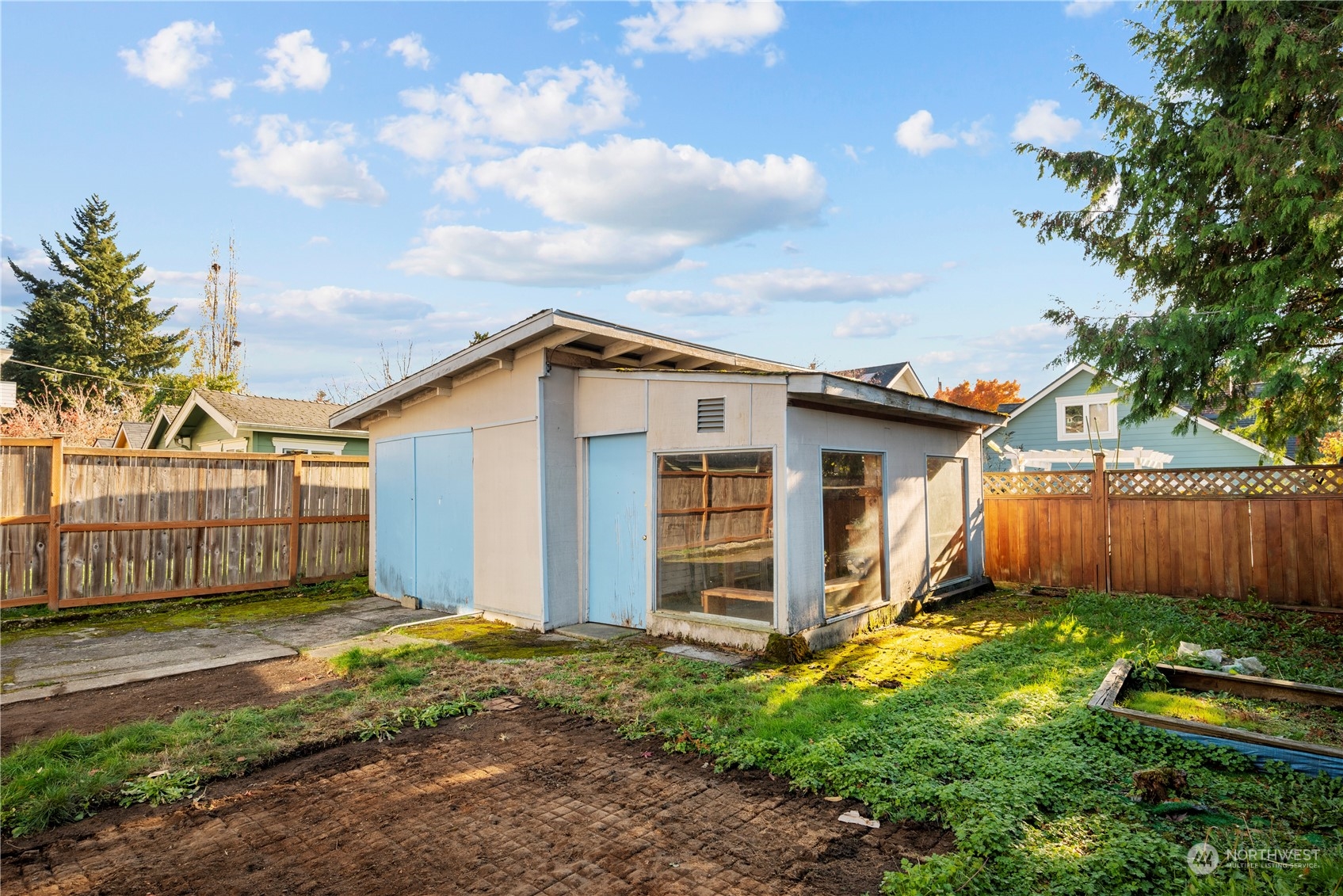 517 North 84th Street Seattle, WA 98103 - Photo 24 of 29 a view of a house with backyard and garden