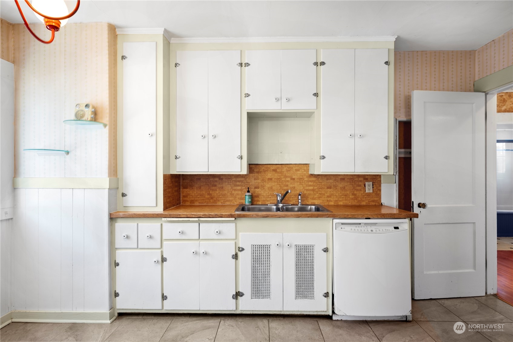 517 North 84th Street Seattle, WA 98103 - Photo 9 of 29 a kitchen with stainless steel appliances granite countertop a refrigerator and a stove