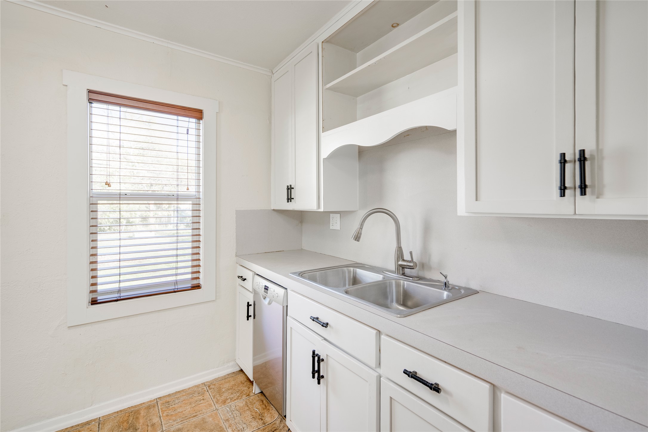4804 Tanney Street Austin, TX 78721 - Photo 17 of 40 A well-appointed kitchen offers ample counter space and bright cabinetry.