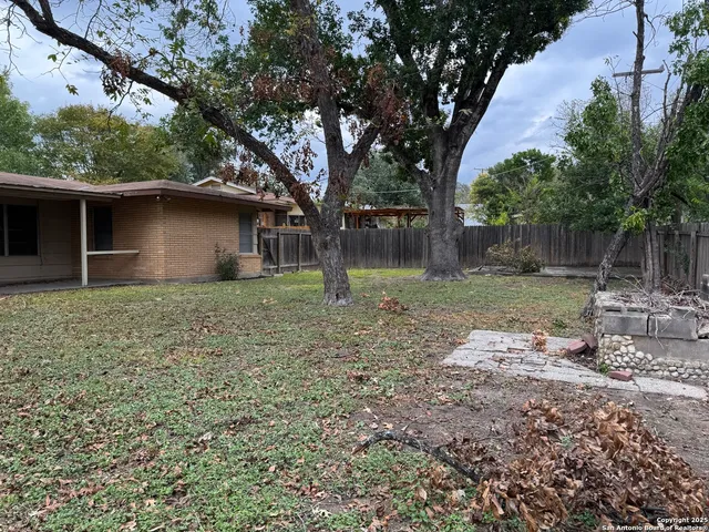 a backyard of a house with lots of green space
