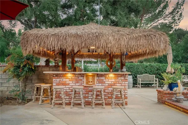 a view of backyard with seating area and green space