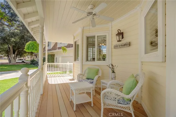 a front view of a house with outdoor seating