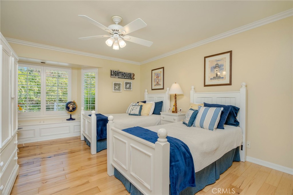 27767 Sand Canyon Road Canyon Country, CA 91387 - Photo 37 of 64 a bed room with a bed and a chandelier