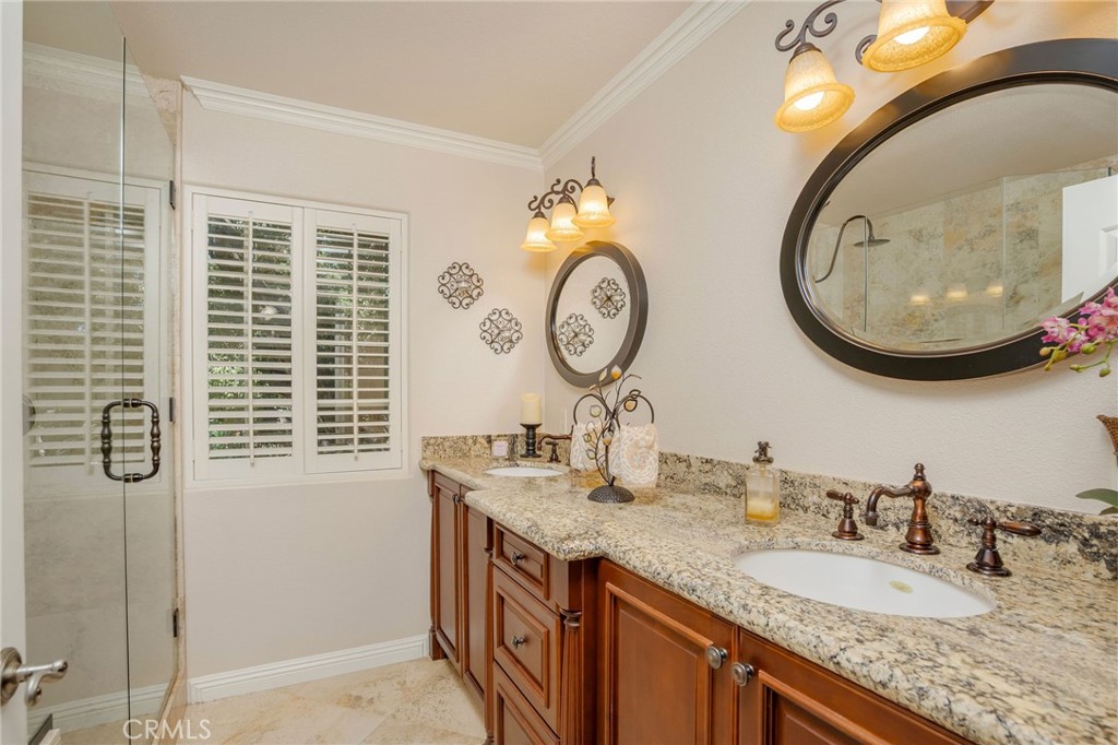 27767 Sand Canyon Road Canyon Country, CA 91387 - Photo 38 of 64 a bathroom with a granite countertop sink and a mirror