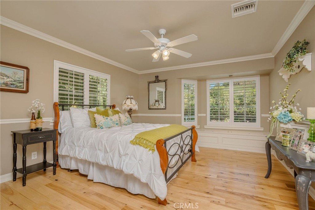 27767 Sand Canyon Road Canyon Country, CA 91387 - Photo 38 of 63 a bedroom with a bed and wooden floor