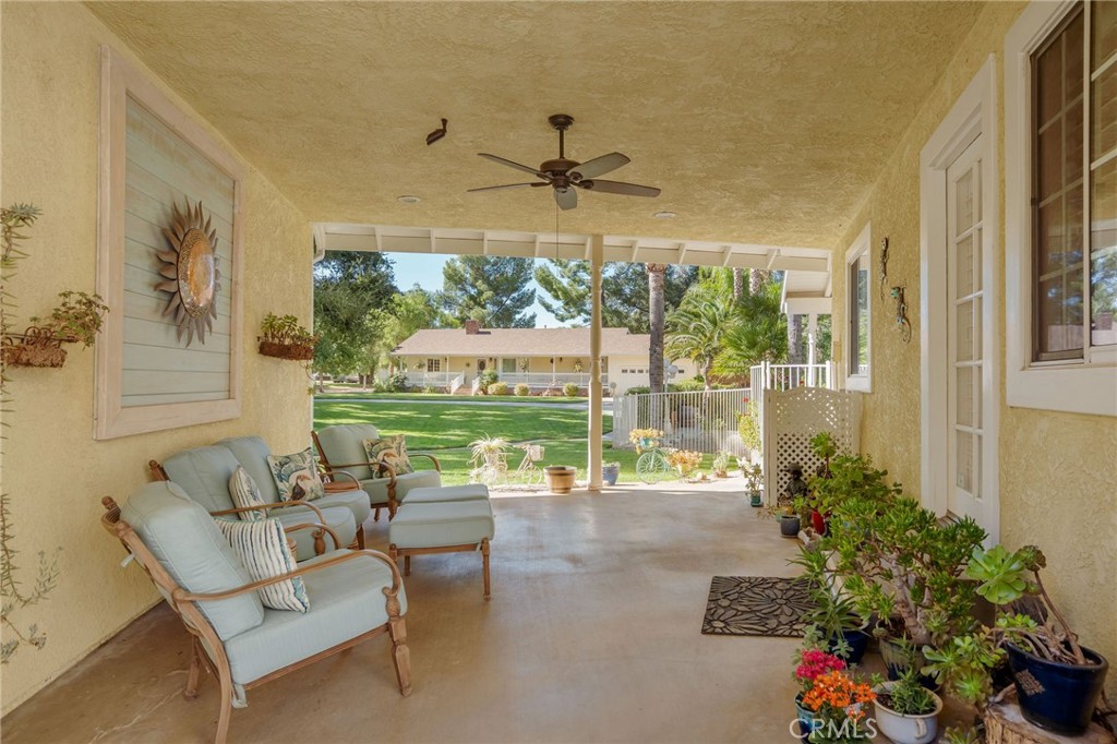 27767 Sand Canyon Road Canyon Country, CA 91387 - Photo 40 of 63 a dining room with furniture water view and a floor to ceiling window