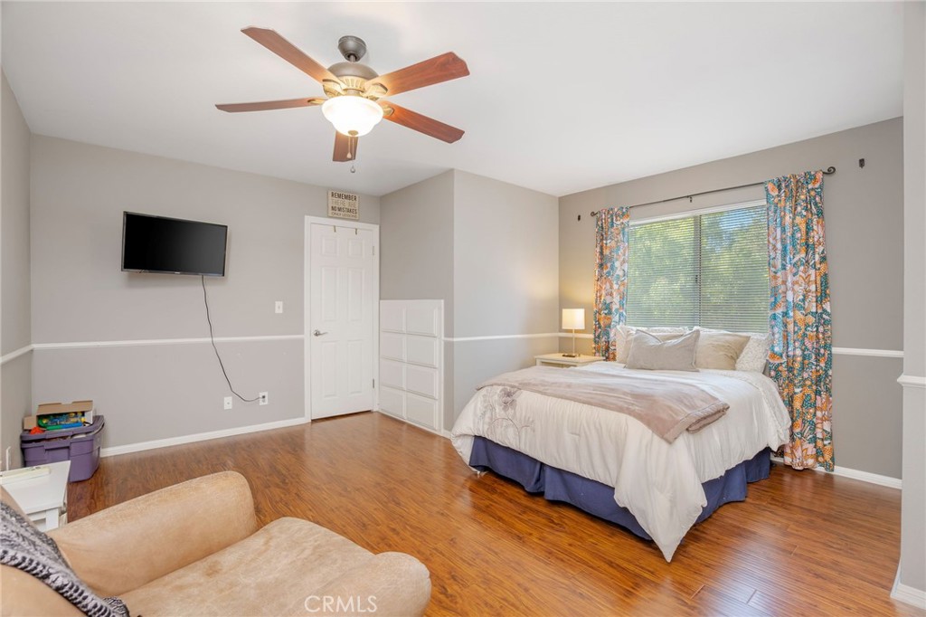 27767 Sand Canyon Road Canyon Country, CA 91387 - Photo 49 of 63 a bedroom with a bed and a flat screen tv