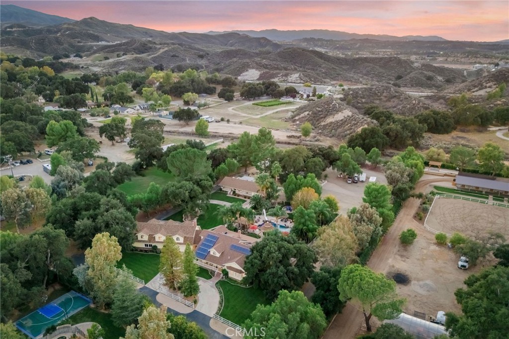 27767 Sand Canyon Road Canyon Country, CA 91387 - Photo 5 of 64 an aerial view of green landscape with trees houses and mountain view