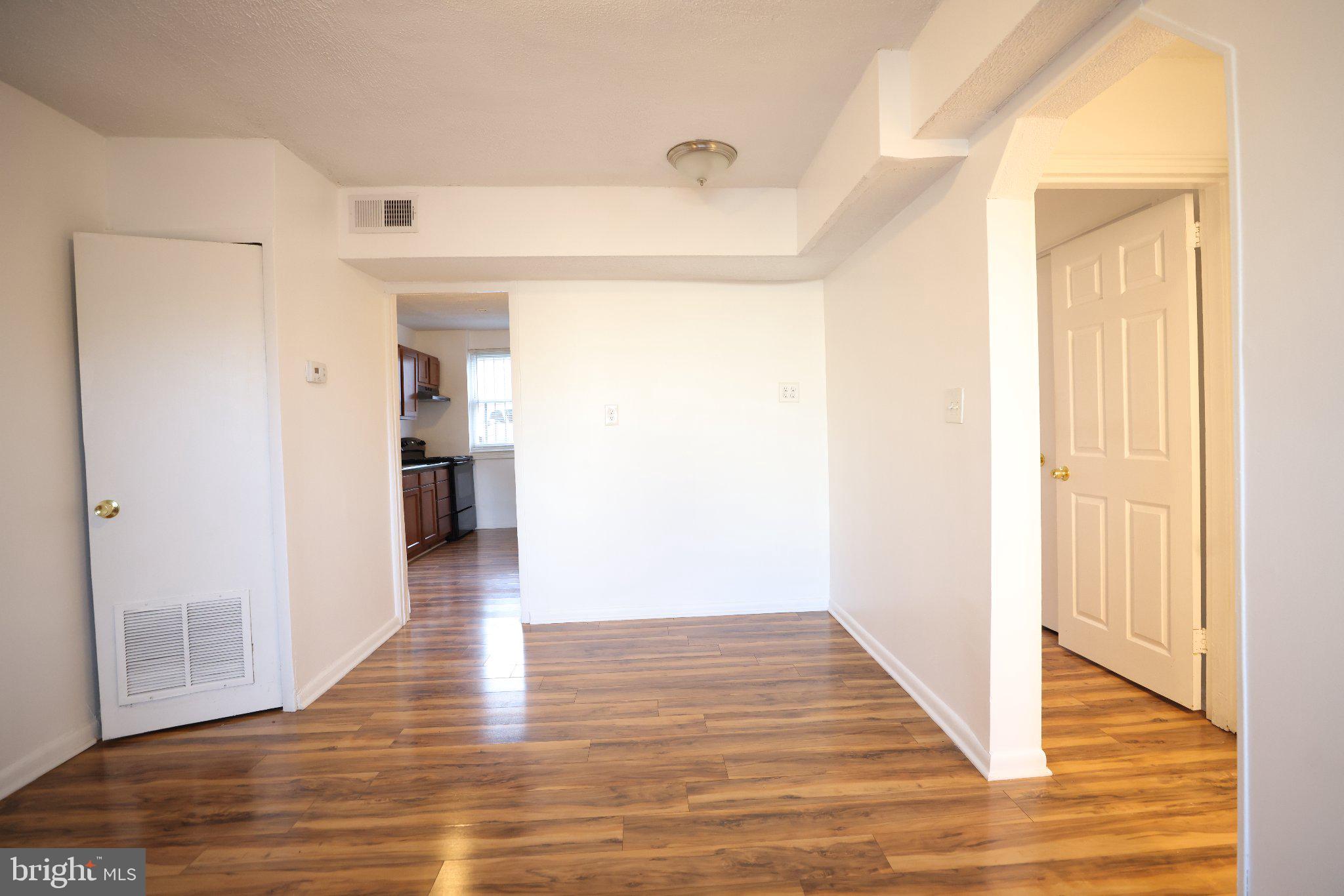 4329 Halley Terrace Southeast, Unit 3 Washington, DC 20032 - Photo 7 of 8 a view of a hallway with wooden floor