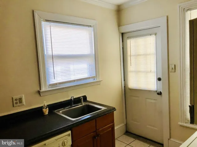 a kitchen with a sink and a window