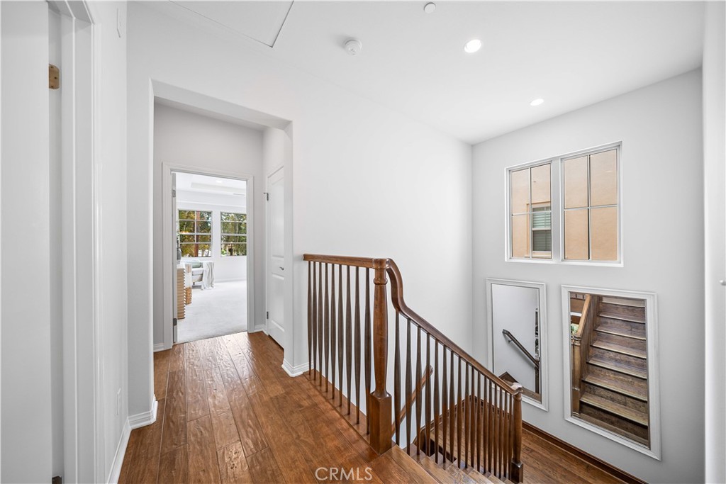 33 Jonquil Irvine, CA 92618 - Photo 21 of 48 a view of a hallway with wooden floor and windows