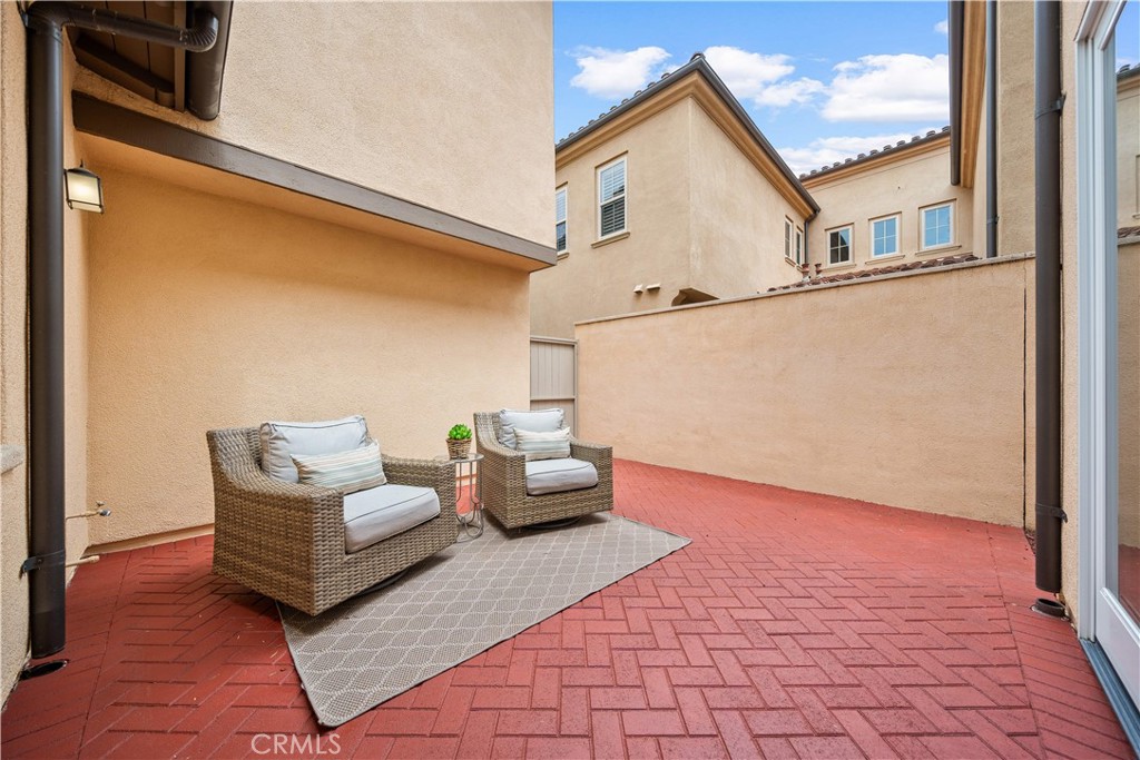 33 Jonquil Irvine, CA 92618 - Photo 33 of 48 a view of a patio with couches chairs and potted plants