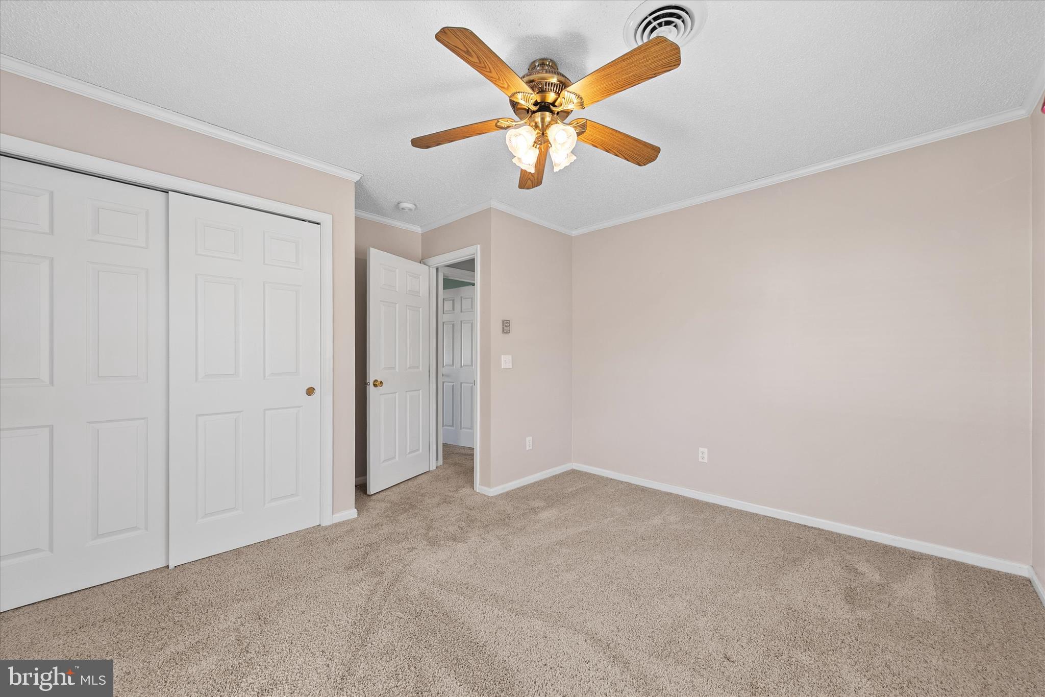 13 South Primrose Lane Ocean View, DE 19970 - Photo 20 of 38 an empty room with a ceiling fan and window