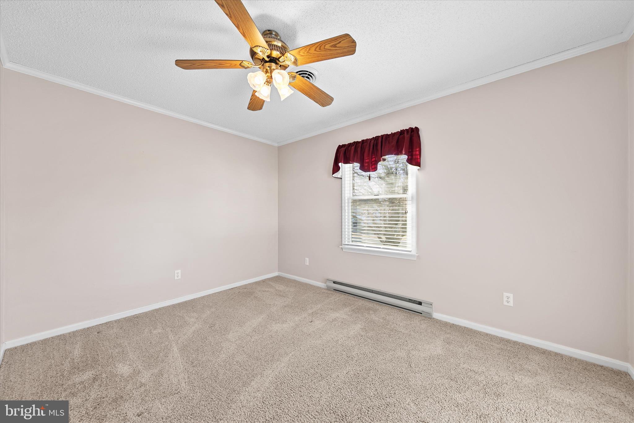 13 South Primrose Lane Ocean View, DE 19970 - Photo 21 of 38 an empty room with windows and fan