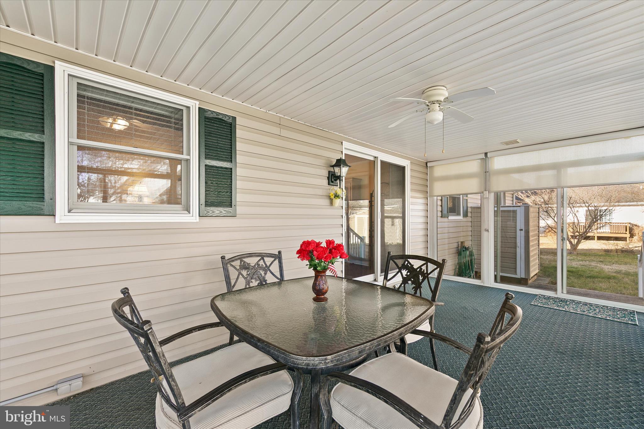 13 South Primrose Lane Ocean View, DE 19970 - Photo 29 of 38 a view of a dining room with furniture wooden floor and chandelier