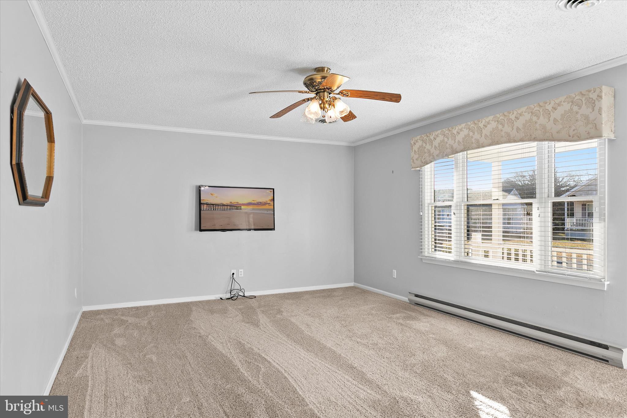 13 South Primrose Lane Ocean View, DE 19970 - Photo 8 of 38 a view of a livingroom with a ceiling fan and window
