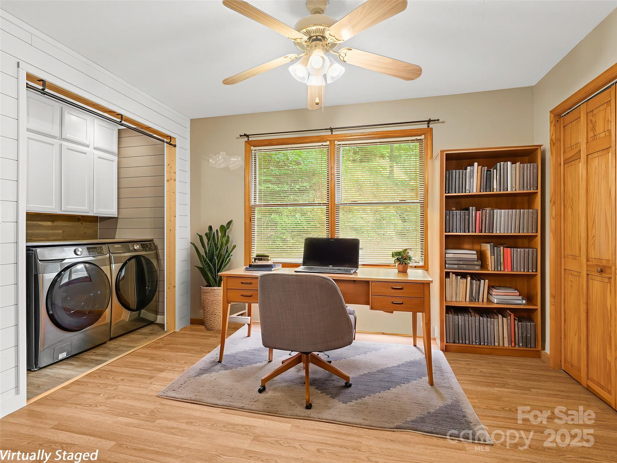 120 Wolf Pen Cove Road Brevard, NC 28712 - Photo 19 of 32 a view of a workspace with furniture and a window