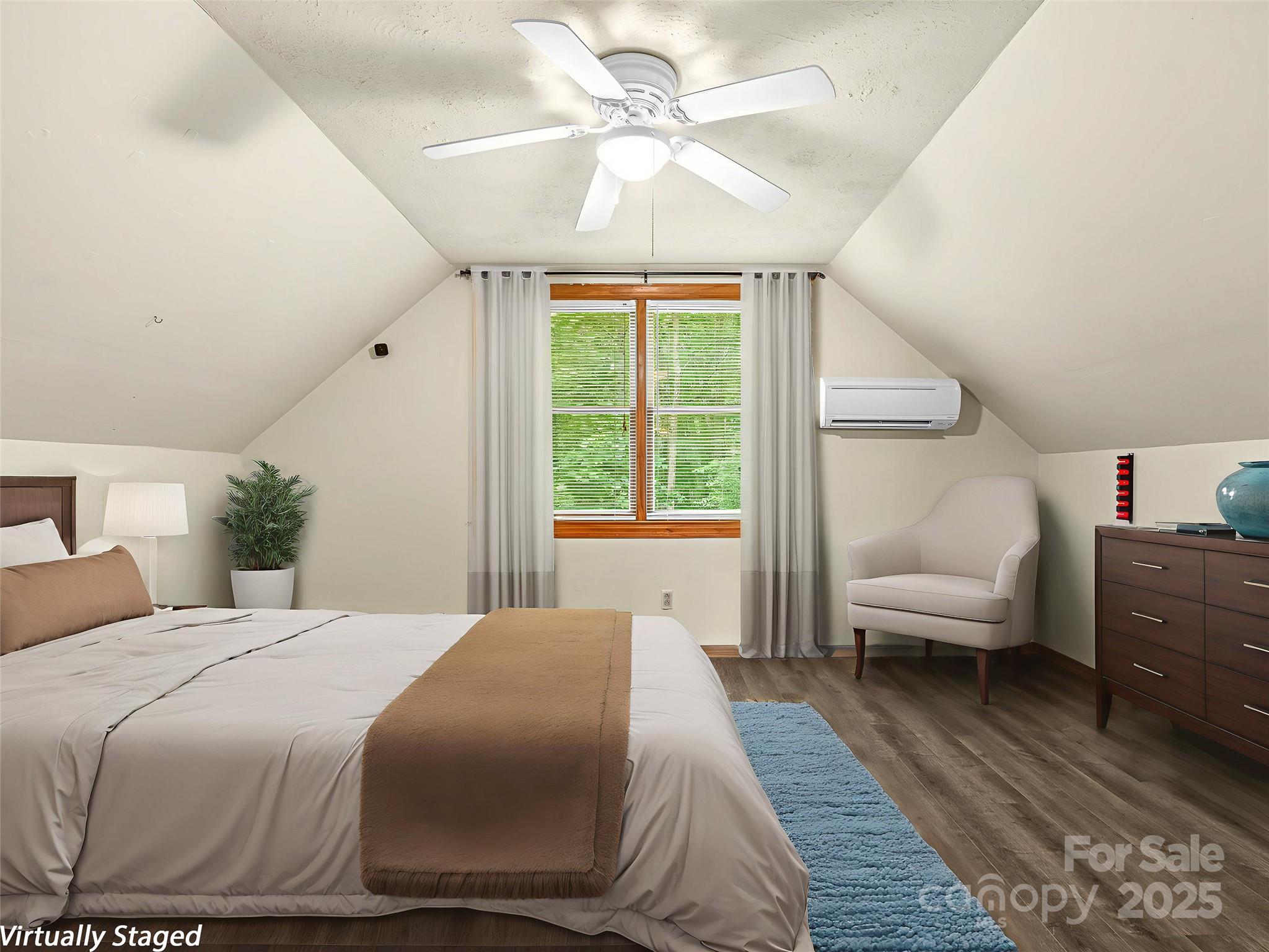 120 Wolf Pen Cove Road Brevard, NC 28712 - Photo 23 of 32 a bedroom with a large bed and a window