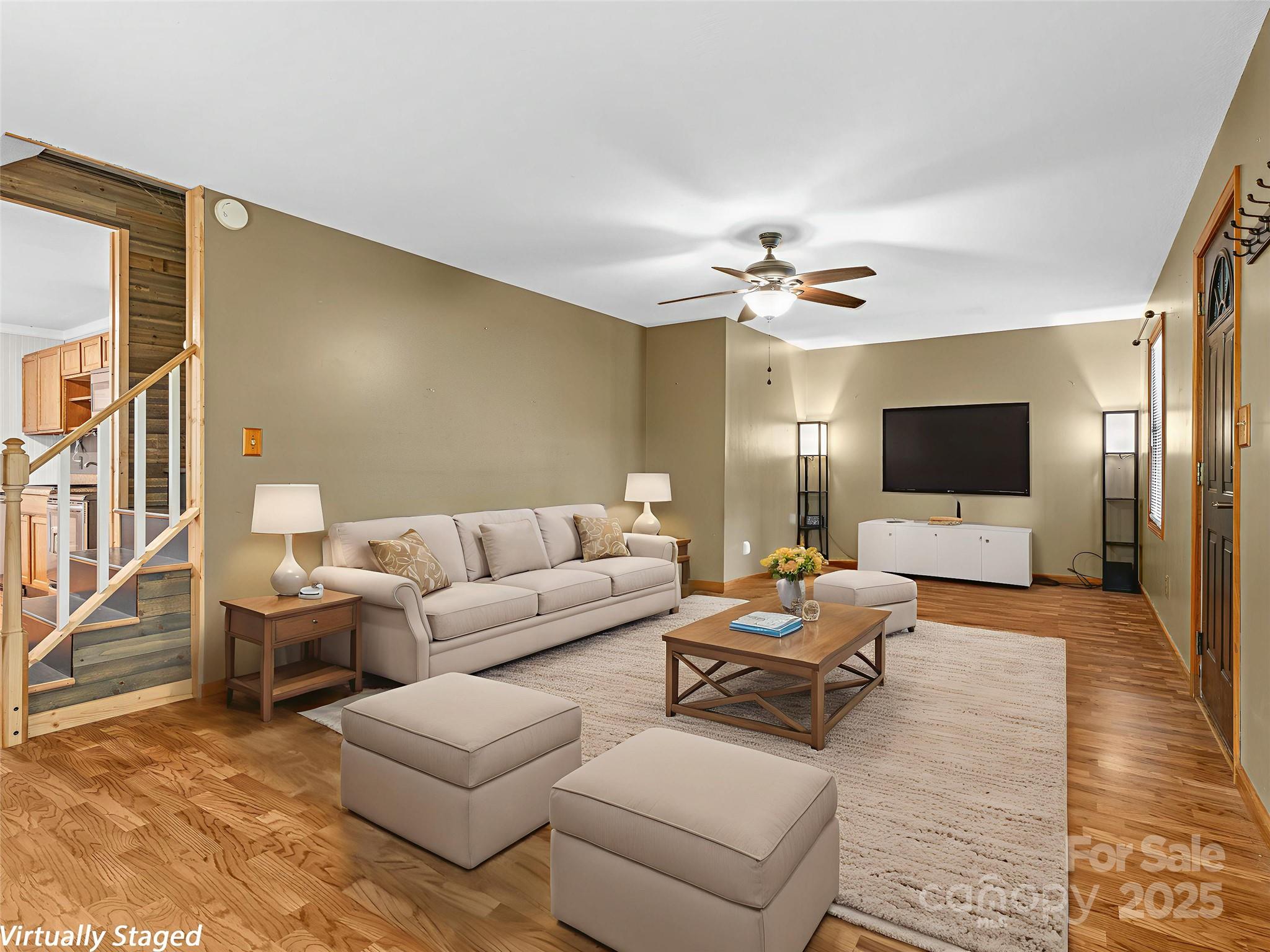 120 Wolf Pen Cove Road Brevard, NC 28712 - Photo 9 of 32 a living room with furniture and a flat screen tv
