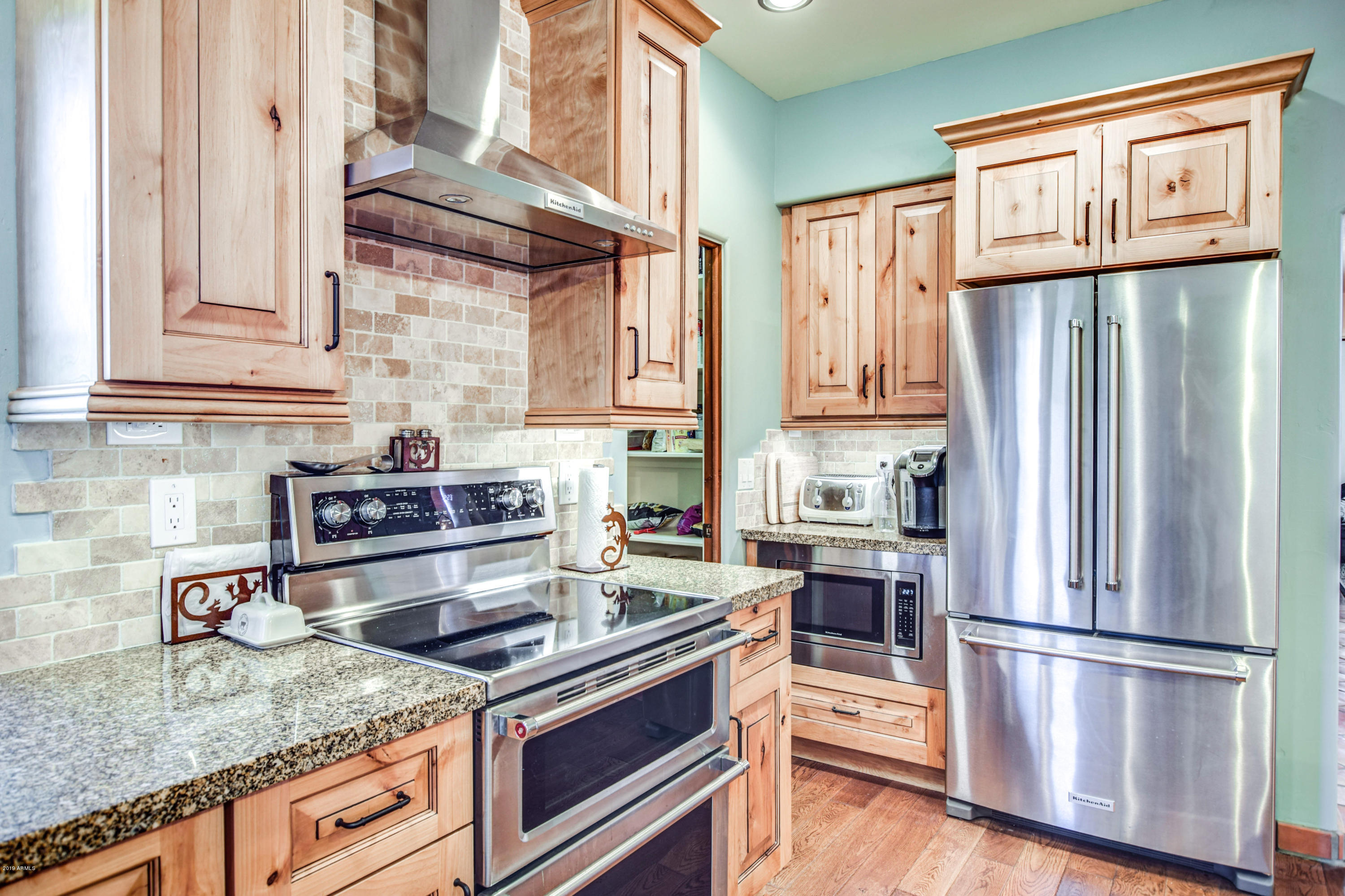 3530 North Hawes Road, Unit 10 Mesa, AZ 85207 - Photo 18 of 76 a kitchen with stainless steel appliances granite countertop a refrigerator sink and stove
